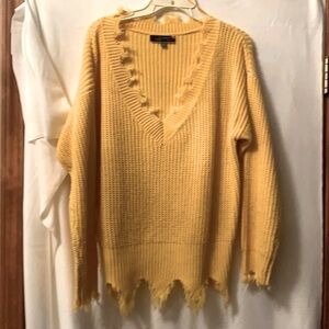 Yellow jagged edge sweater